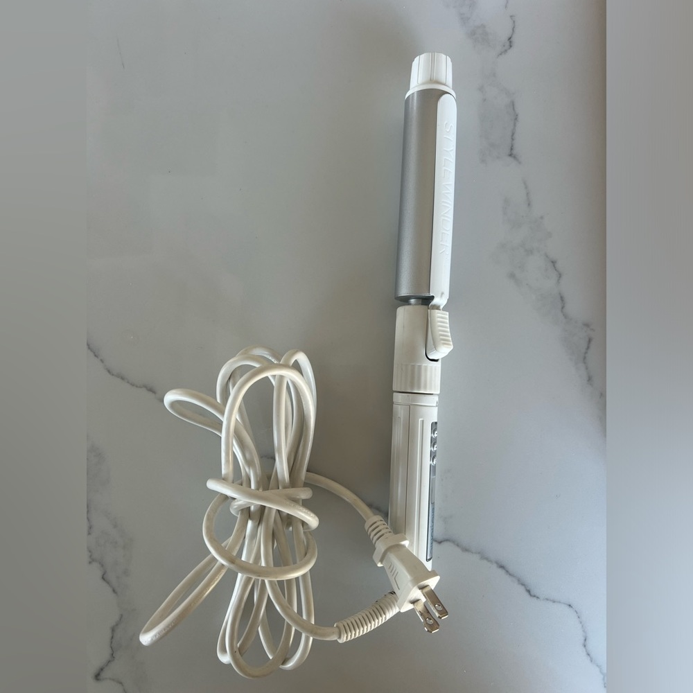 Bio Ionic Stylewinder 1.25” Curling iron. Used 3 times. Works as intended.